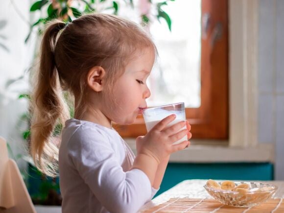 Infant girl drinking milk