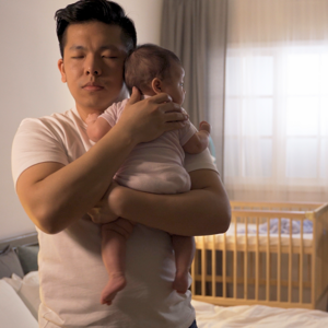 dad making baby sleep