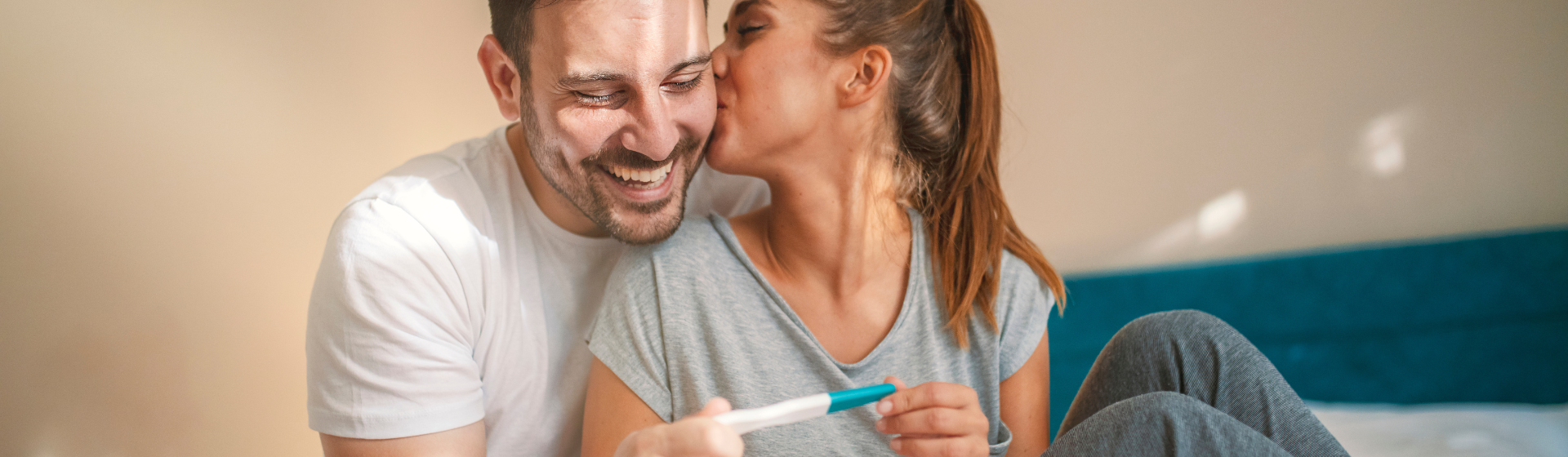 couple holding a pregnancy test